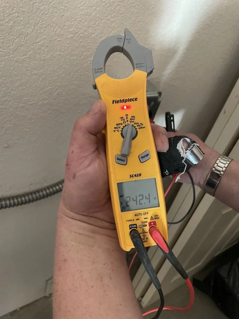 Voltage testing with clamp meter during Whole House Surge Protector in Ava